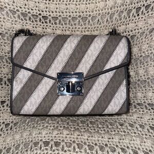 Michael Kors Grey and White Striped Crossbody Bag with silver hardware.